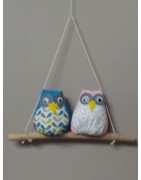 Familles de chouettes sur bois flotté